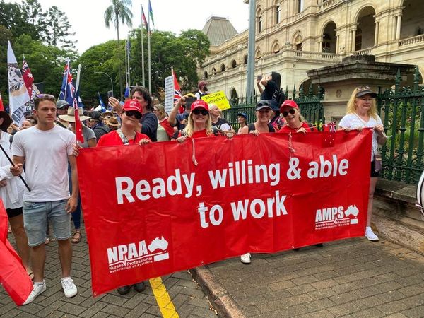 AMPS and NPAA members at a rally holding a 
